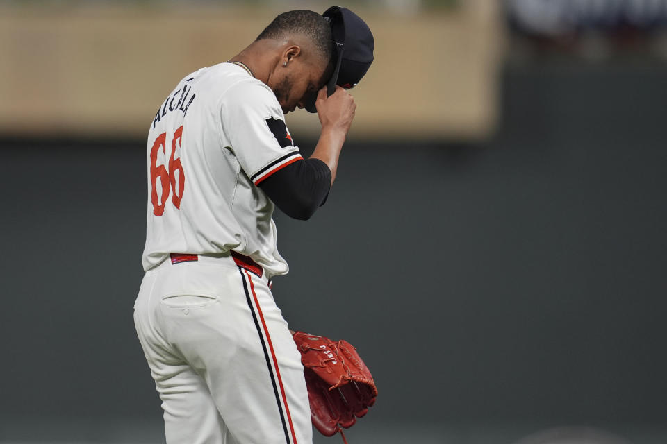 Minnesota Twins relief pitcher Jorge Alcala (66) walks back to the dugout after the top of the ninth inning of a baseball game against the Seattle Mariners, Tuesday, May 7, 2024, in Minneapolis. (AP Photo/Abbie Parr)