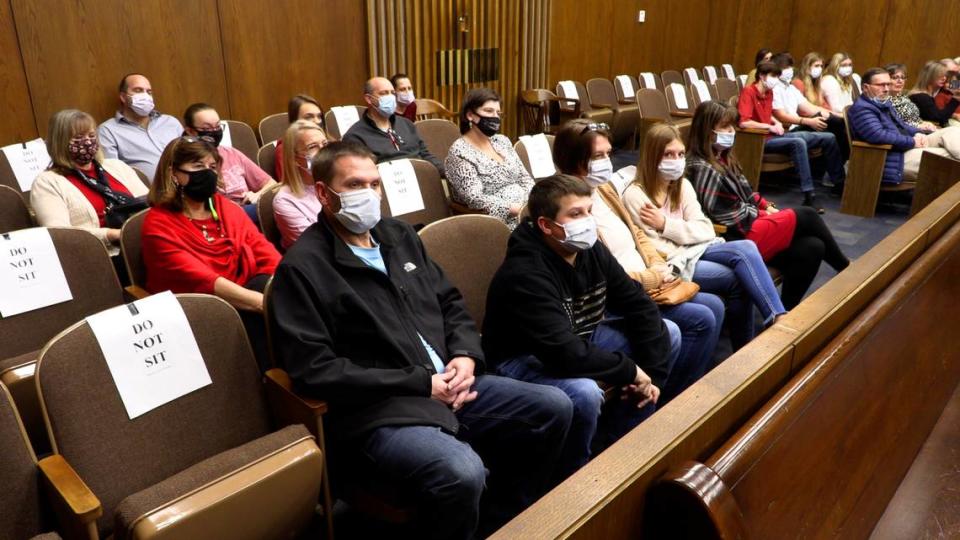 A large group of family, friends and co-workers of Angela and Elliott Turbeville came to court Monday afternoon to witness the couple finalize the adoption of six children, all siblings.