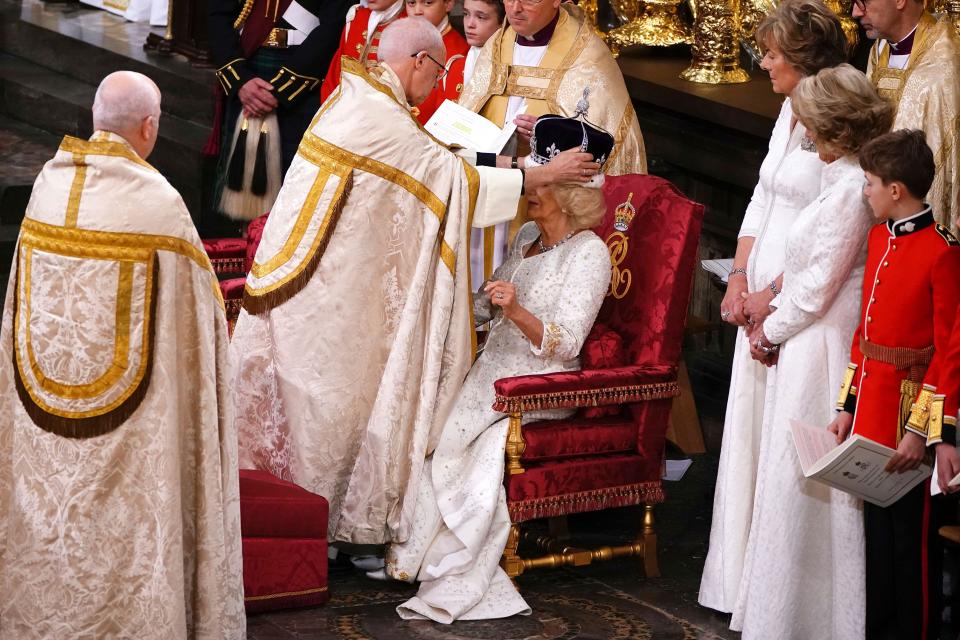 Queen Camilla is crowned with Queen Mary's Crown by The Archbishop of Canterbury the Most Reverend Justin Welby, in Westminster Abbey, London, Saturday May 6, 2023. (Yui Mok, Pool via AP)