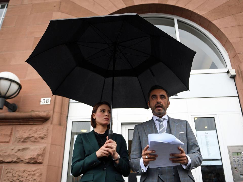 British lawyer Aamer Anwar (R) reads a statement to the media in Glasgow on November 24, 2020 on the opening day of a posthumous appeal against the conviction of Libyan Abdelbaset Mohmet al-Megrahi