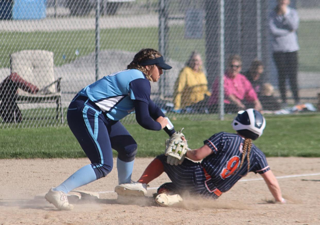 Prairie Central's Jules Woodrey tags out Pontiac's India Mattingly at third base Thursday.