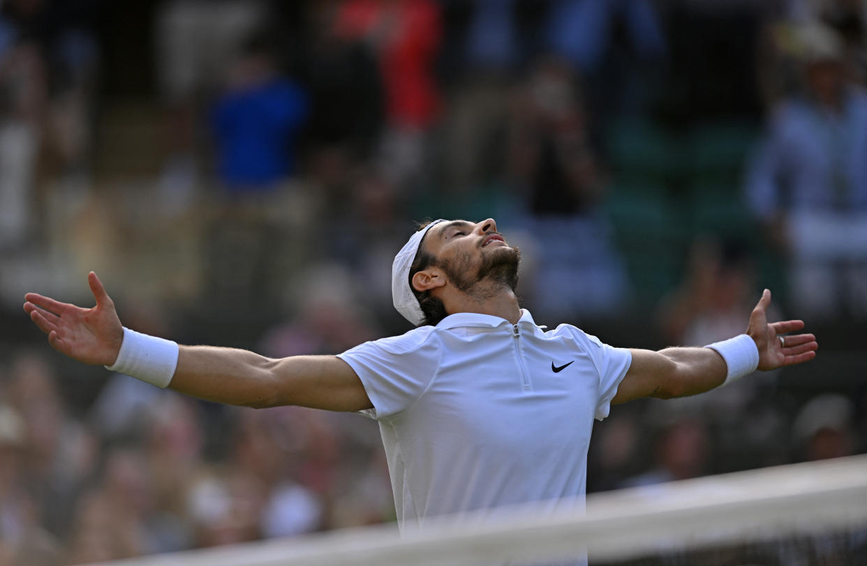 Italy's Lorenzo Musetti celebrates winning against US player Taylor Fritz during their men's singles quarter-finals tennis match on the tenth day of the 2024 Wimbledon Championships at The All England Lawn Tennis and Croquet Club in Wimbledon, southwest London, on July 10, 2024. Musetti won the match 3-6, 7-6, 6-2, 3-6, 6-1 (Photo by ANDREJ ISAKOVIC / AFP) / RESTRICTED TO EDITORIAL USE (Photo by ANDREJ ISAKOVIC/AFP via Getty Images)