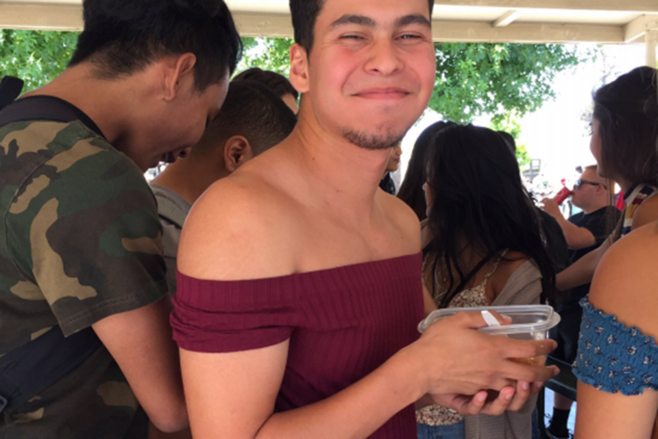 A pupil wears an off the shoulder top in protest: Twitter @ocean_avenue_