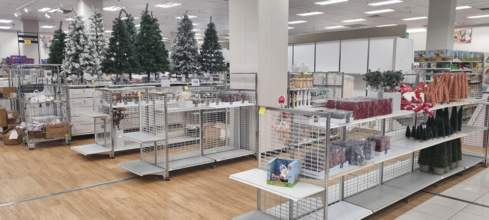 Christmas trees and decorations on display in Kmart