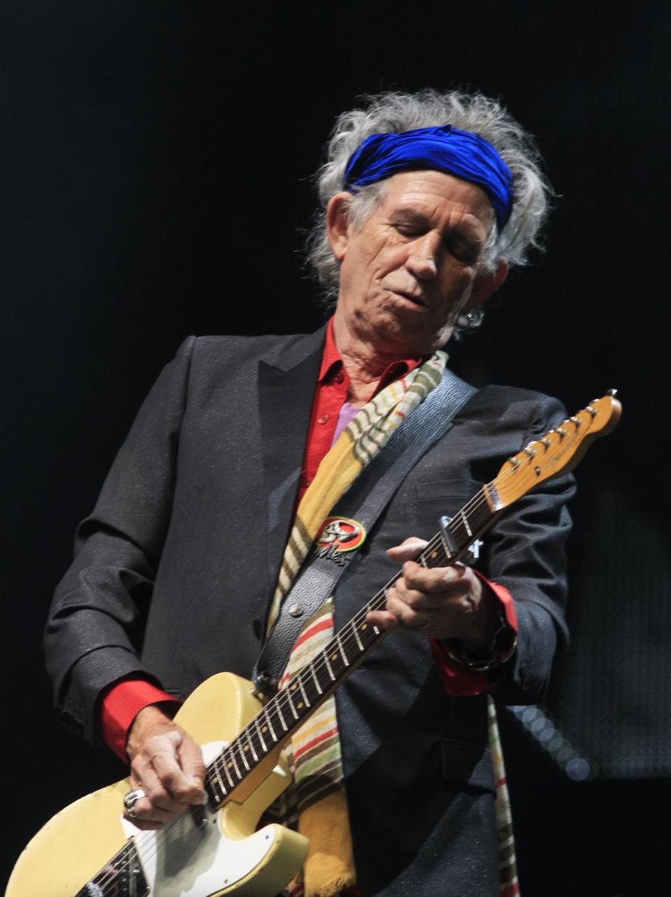 Keith Richards of The Rolling Stones performs at Glastonbury, England on Saturday, June 29, 2013. Thousands are to enjoy the three day festival that started on Friday, June 28, 2013 with headliners Arctic Monkeys, the Rolling Stones and Mumford and Sons. (Photo by Jim Ross/Invision/AP)