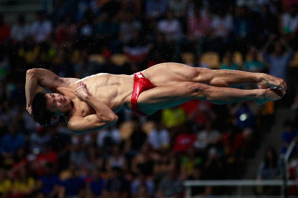 <p>Yuan Cao of China competes in the Men’s Diving 3m Springboard semi final at the Maria Lenk Aquatics Centre on August 16, 2016 in Rio de Janeiro, Brazil. (Photo by Adam Pretty/Getty Images) </p>
