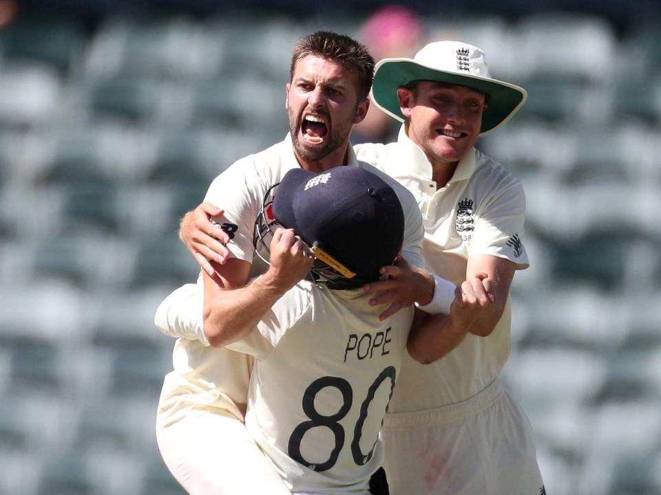 Mark Wood celebrates taking the key wicket of Rassie van der Dussen: Reuters