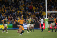 Australia's Nic White kneels down following his team's loss to South Africa in their Championship Rugby test match in Sydney, Saturday, Sept. 3, 2022. (AP Photo/Rick Rycroft)