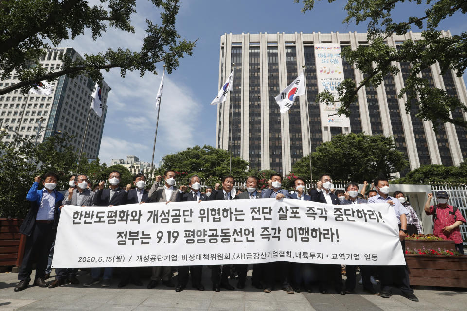 Officials of South Korean businesses with plants in the now-suspended inter-Korean factory complex in North Korea's border town of Kaesong, stage a rally against the flying of anti-North Korea leaflets into North Korea in front of the Government Complex in Seoul, South Korea, Monday, June 15, 2020. South Korea on Sunday convened an emergency security meeting and urged North Korea to uphold reconciliation agreements, hours after the North threatened to demolish a liaison office and take military action against its rival. The sign reads "Stop the flying of propaganda leaflets into North Korea." (AP Photo/Ahn Young-joon)