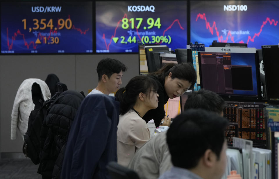 Currency traders work at the foreign exchange dealing room of the KEB Hana Bank headquarters in Seoul, South Korea, Wednesday, Oct. 18, 2023. (AP Photo/Ahn Young-joon)