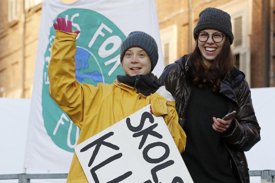 Greta Thunberg holds a sign with writing in Swedish that says, "School strike for the climate" as she attends a climate march, in Turin, Italy, in December. (Photo: ASSOCIATED PRESS)