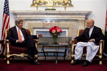 U.S. Secretary of State John Kerry (L) meets with Afghan President Hamid Karzai, in Kabul October 11, 2013. REUTERS/Jacquelyn Martin/Pool