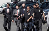 Brazilian Olympic Committee (COB) President Carlos Arthur Nuzman (C) arrives to Federal Police headquarters in Rio de Janeiro, Brazil September 5, 2017. REUTERS/Ricardo Moraes