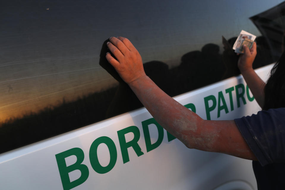 <p>An undocumented immigrant is bodysearched by a U.S. Border Patrol agent after being caught hiding in a sugarcane field near the U.S.-Mexico Border on June 12, 2018 near Mission, Texas. (Photo: John Moore/Getty Images) </p>