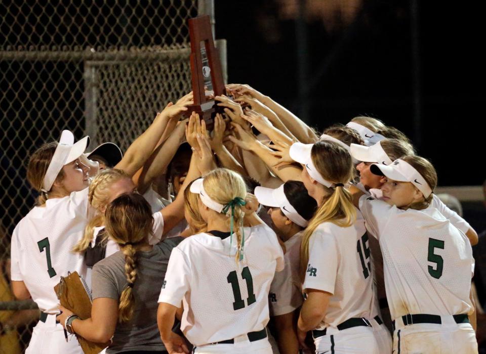 Lakewood Ranch hoists the championship trophy after defeating Venice, 1-0, in the Class 7A-District 8 softball final Thursday night at Lakewood Ranch High.