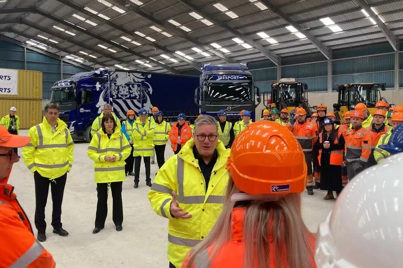 Keir Starmer, Rachel Reeves and Ed Milibandspeaking to workers at PD Ports