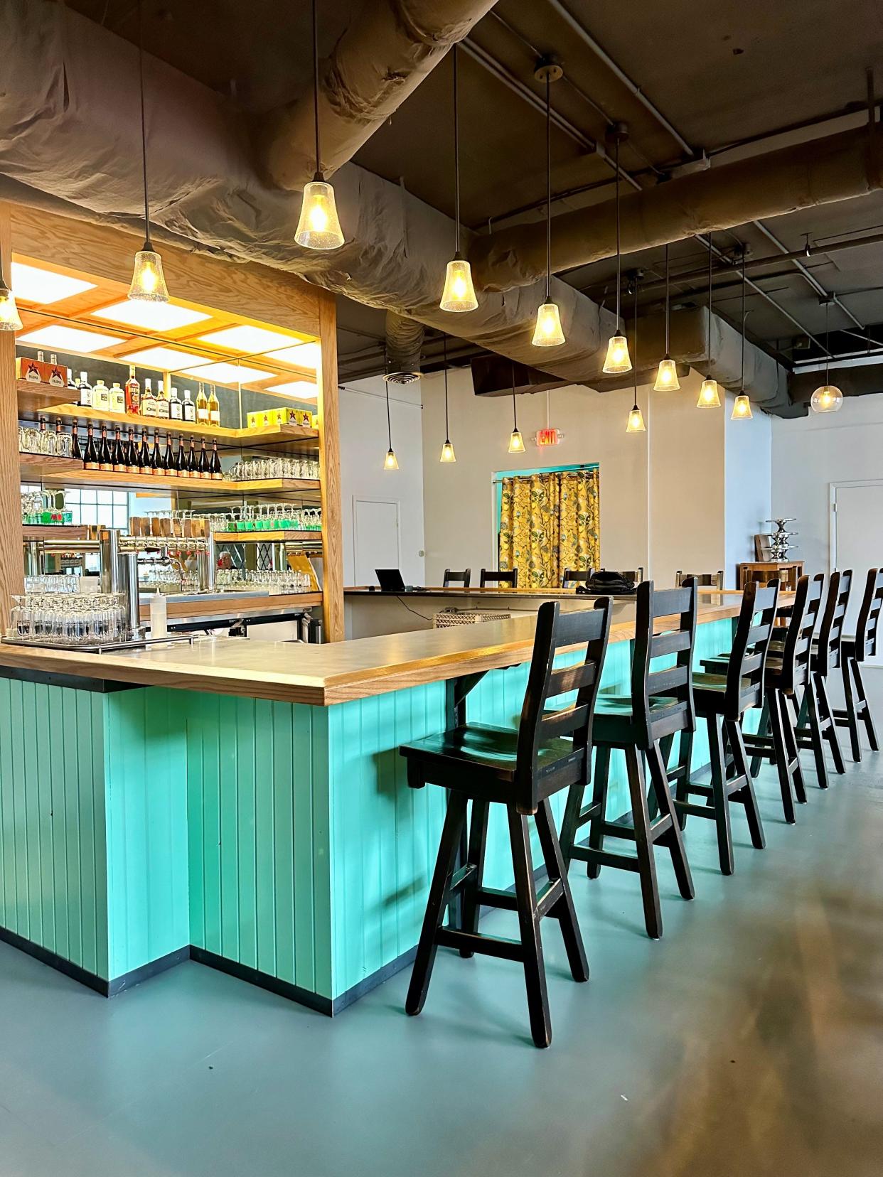 The new bar area at Woodshop, with tables and chairs scattered throughout the room, makes for a welcoming and relaxing atmosphere to enjoy a slow pour, a cocktail, a glass of wine and something to eat.