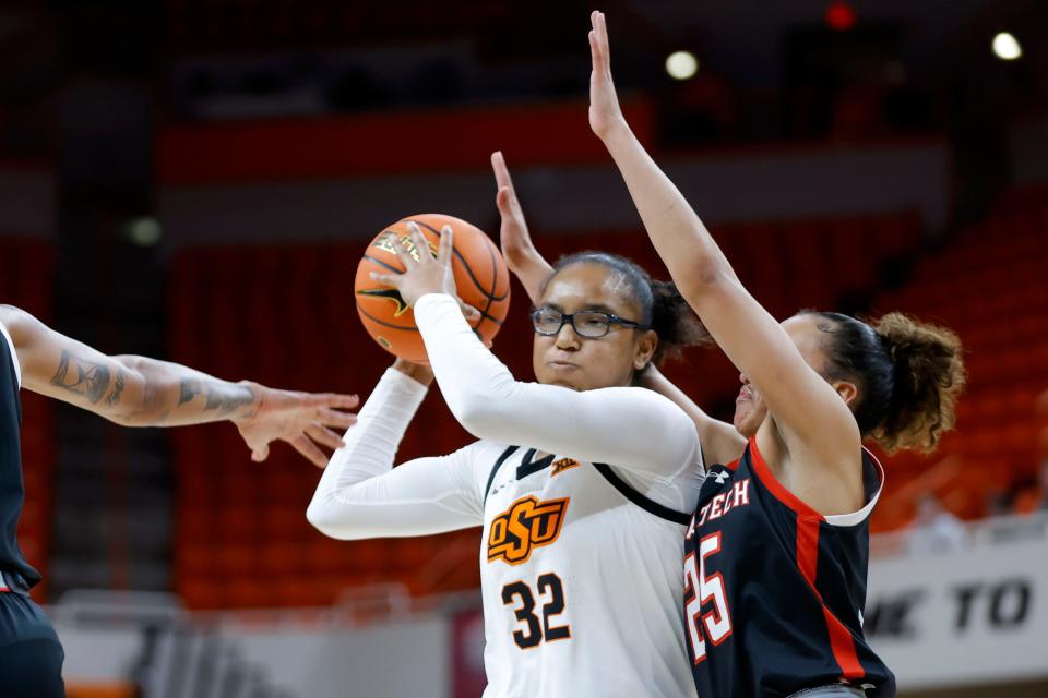 Oklahoma State Cowgirls guard Stailee Heard (32) passes the ball as Texas Tech Lady Raiders guard Ashley Chevalier (25) defends during a women's college basketball game between the Oklahoma State Cowgirls (OSU) and the Texas Tech Lady Raiders at Gallagher-Iba Arena in Stillwater, Okla., Wednesday, Jan. 10, 2024. Oklahoma State won 71-58.