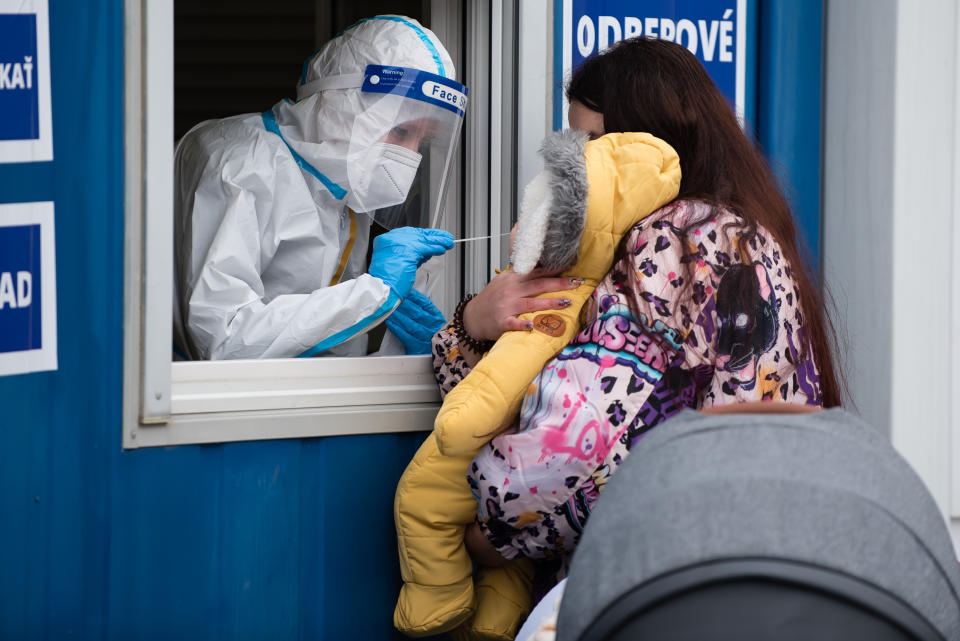  A health worker wearing a protective suit takes a nasal swab sample from a baby through a window during the COVID19 mass testing.
As the Covid-19 situation in Slovakia remains critical, Slovak government with PM Igor Matovic have introduced mass testing of the population. Starting today 18th of January large-scale testing will continue until 26th of January. The government hopes the nationwide testing will speed up a recovery from the latest wave of the coronavirus. (Photo by Tomas Tkacik / SOPA Images/Sipa USA) 