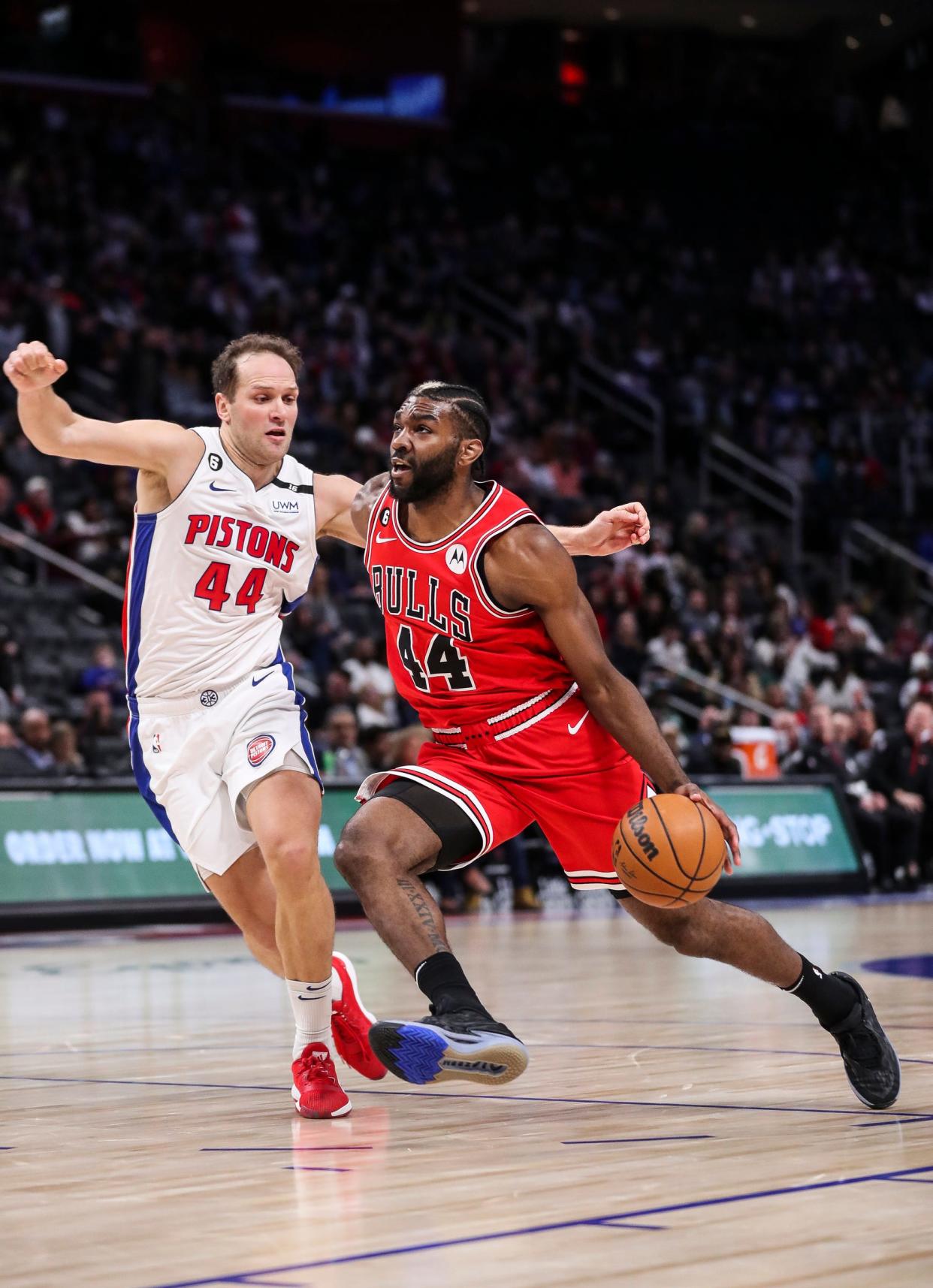 Bulls forward Patrick Williams dribbles against Pistons forward Bojan Bogdanovic during the first half on Wednesday, March 1, 2023, at Little Caesars Arena.