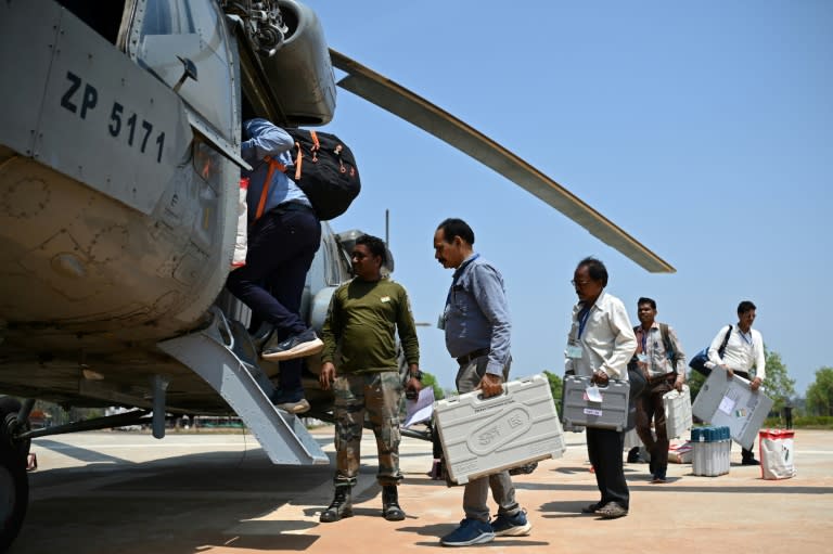 Voting in India, the world's most populous nation, is a major logistical exercise: here polling officials on army helicopters bring electronic voting machines to Chhattisgarh state (Idrees MOHAMMED)