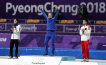 Speed Skating - Pyeongchang 2018 Winter Olympics - Men's 500m competition finals - Gangneung Oval - Gangneung, South Korea - February 19, 2018 - Havard Lorentzen of Norway celebrates a on the podium after winning a gold medal. REUTERS/John Sibley