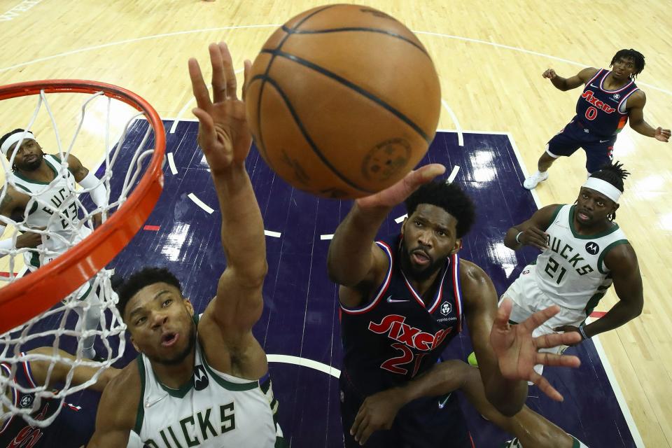 Giannis Antetokounmpo goes up for a block on a Joel Embiid putback in the final seconds at Wells Fargo Center on March 29 in Philadelphia. The block preserved a 118-116 Bucks win.