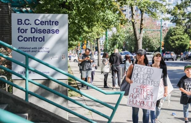 Thousands of people protesting against COVID-19 vaccine passports gathered near Vancouver City Hall on Sept. 1, 2021. (Gian Paolo Mendoza/CBC - image credit)