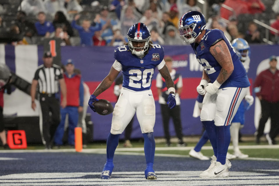 Gray runs for 2 touchdowns as the Giants beat the Lions 143 in a