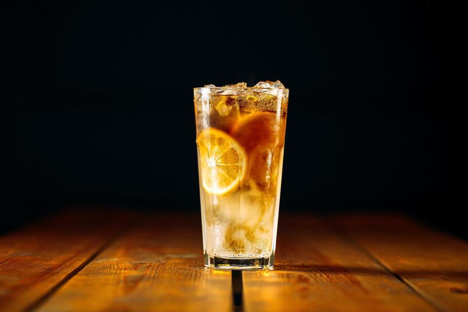 long island ice tea cocktail on the wooden table