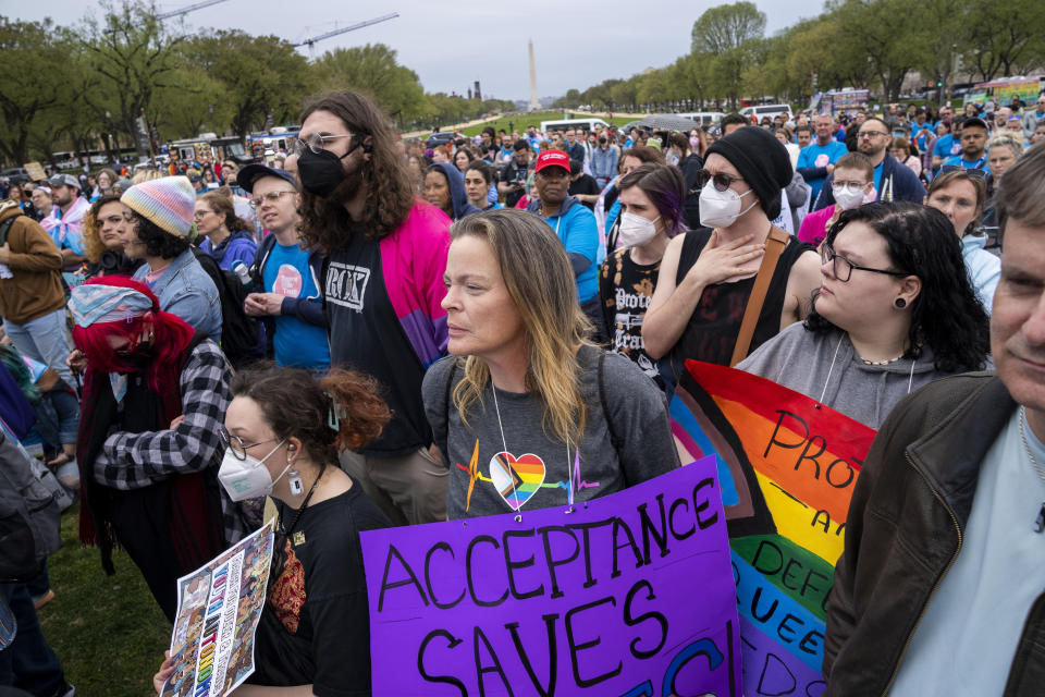 Dawn Whitlow, of Virginia Beach, Va., center, attends a rally as part of Transgender Day of Visibility, Friday, March 31, 2023, by the Capitol in Washington. "I'm here to support the LGBT and Trans community," says Whitlow, who says she is bisexual, "with myself and my nieces being the same way I want to support them the way I wasn't supported." (AP Photo/Jacquelyn Martin)