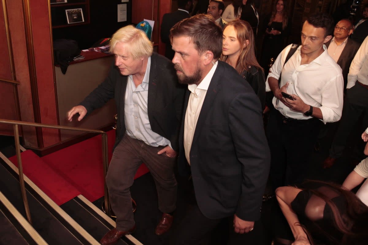 Boris Johnson arriving incognito at his father’s film premier (Sam Furlong / SWNS)