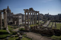 A picture shows the ancient Roman Forum ruins and the Colosseum without people during the coronavirus emergency on March 10, 2020, in Rome, Italy. (Credit: Antonio Masiello/Getty Images)