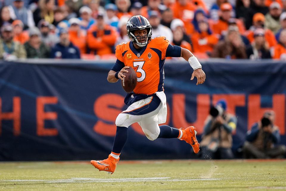 Denver Broncos quarterback Russell Wilson (3) runs the ball in the second quarter against the Los Angeles Chargers in Denver on Jan. 8, 2023 .