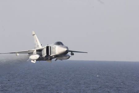 An U.S. Navy picture shows what appears to be a Russian Sukhoi SU-24 attack aircraft flying over the U.S. guided missile destroyer USS Donald Cook in the Baltic Sea in this picture taken April 12, 2016 and released April 13, 2016. REUTERS/US Navy/Handout via Reuters