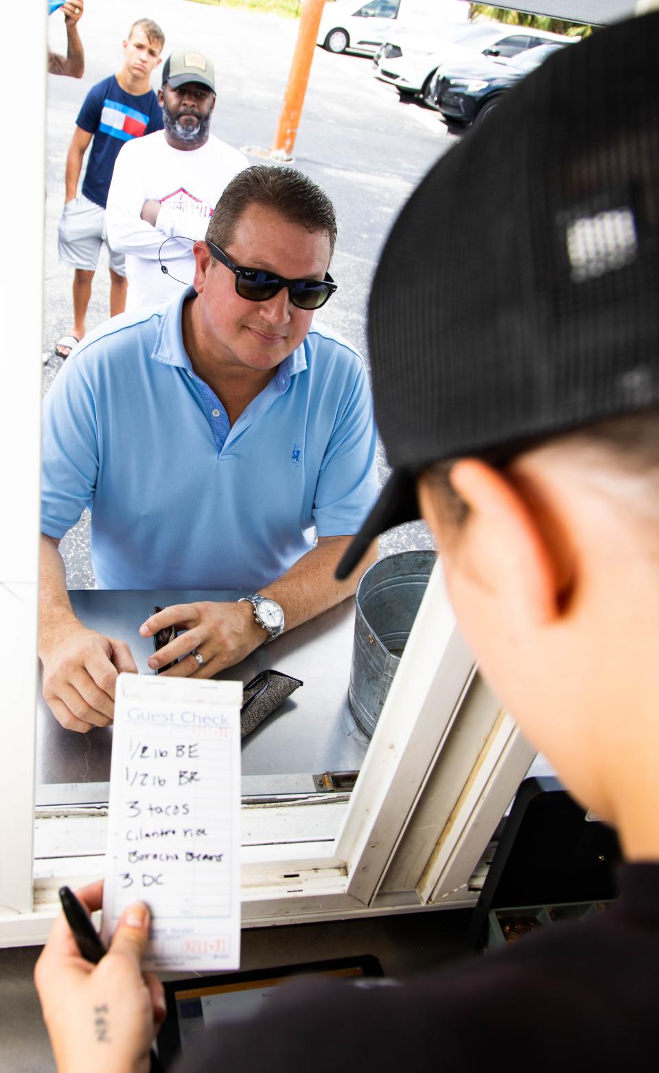 Brandon Perry places his order at Big Lee's on Tuesday.