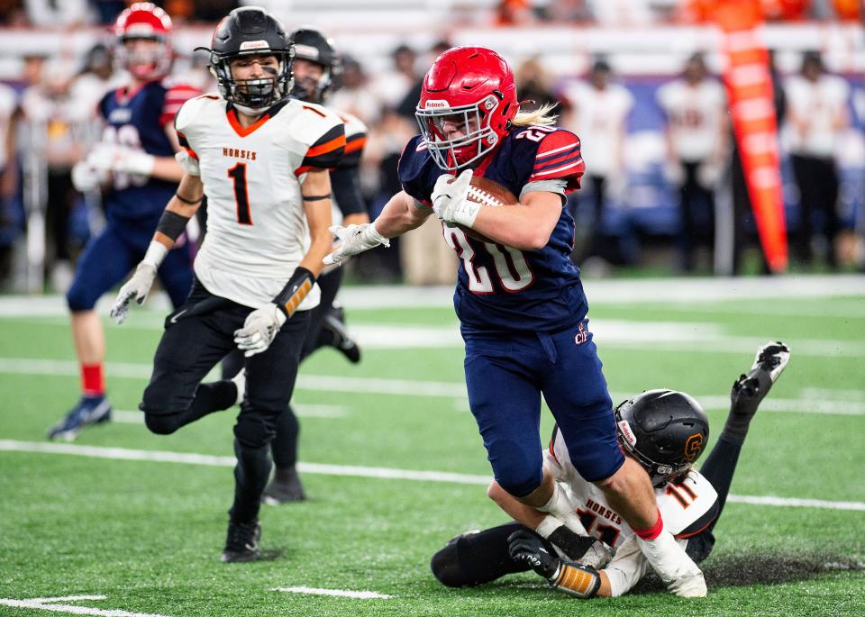 Zander Arnold (20) of Chenango Forks gets past Schuylerville as Chenango Forks captured the Class C NYSPHSAA State Football Championship over Schuylerville at the Carrier Dome in Syracuse on Friday, Dec. 3, 2021. The final score was 0-21. 