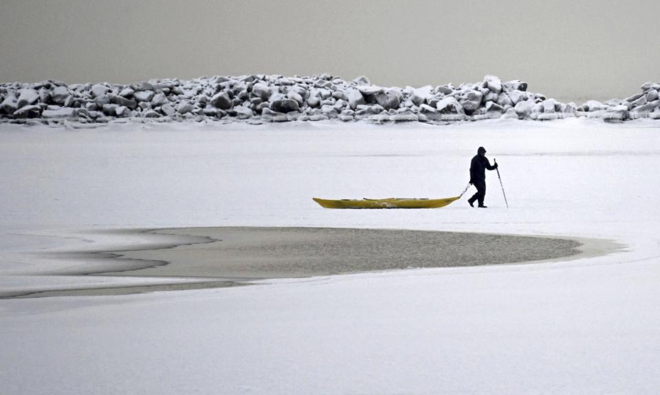 A man walks on the frozen sea in southern Helsinki, Finland, Tuesday, Jan. 2, 2024. Finland and Sweden have recorded this winter’s cold records on Tuesday as a temperatures plummeted to over minus 40 degrees as a result of a cold spell prevailing in the Nordic region. (Vesa Moilanen/Lehtikuva via AP)