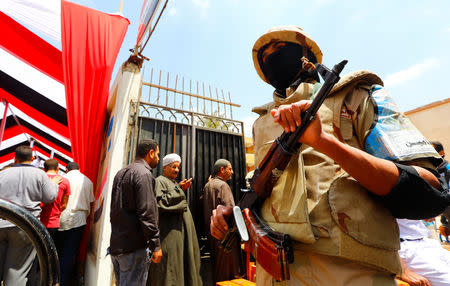 An army soldier stands guard outside a polling station, during the referendum on draft constitutional amendments, in Cairo, Egypt April 20, 2019. REUTERS/Amr Abdallah Dalsh