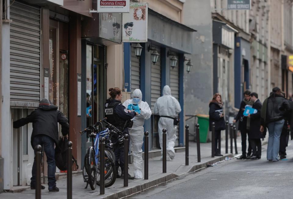 Police investigate at the scene where a shooting took place in Paris on 23 December (Copyright 2022 The Associated Press. All rights reserved)