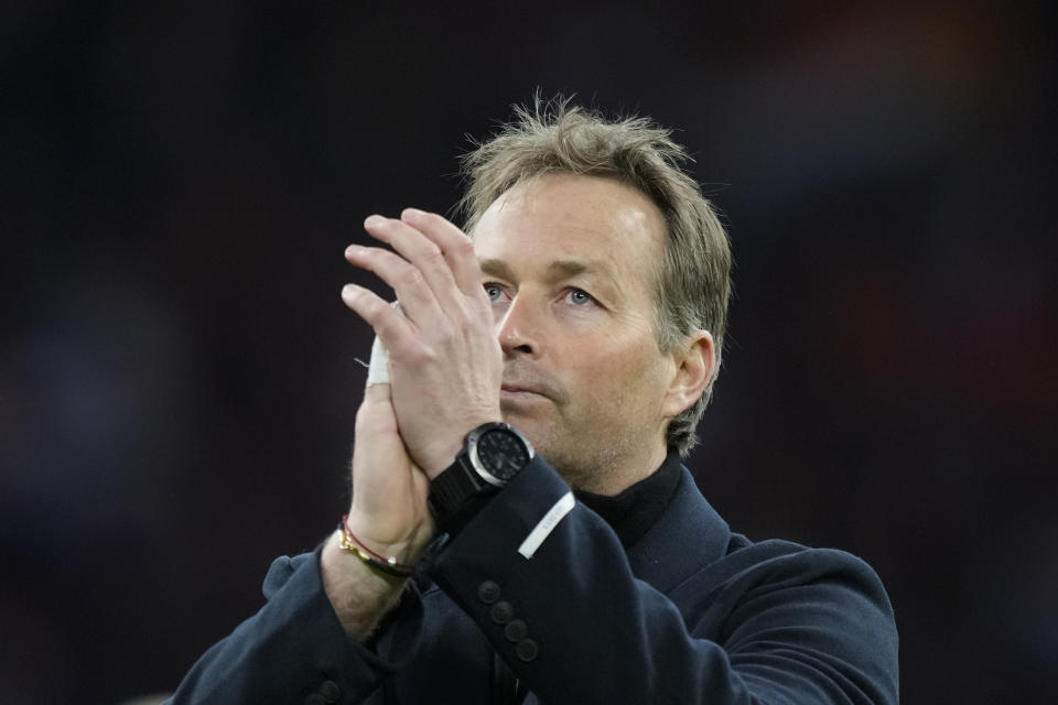 FILE - Denmark's coach Kasper Hjulmand greets fans after the international friendly soccer match between the Netherlands and Denmark at the Johan Cruyff ArenA in Amsterdam, Netherlands, Saturday, March 26, 2022. (AP Photo/Peter Dejong, File)