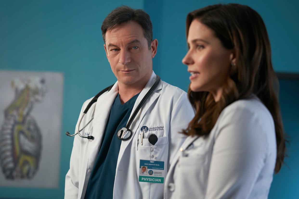 Sophia Bush (right) and Jason Isaacs (left) star in a drama about Dr. Sam Griffith, a gifted heart surgeon who excels in her new leadership role as chief of surgery after her renowned boss, Dr. Rob "Griff" Griffith, falls into a coma, on "Good Sam."