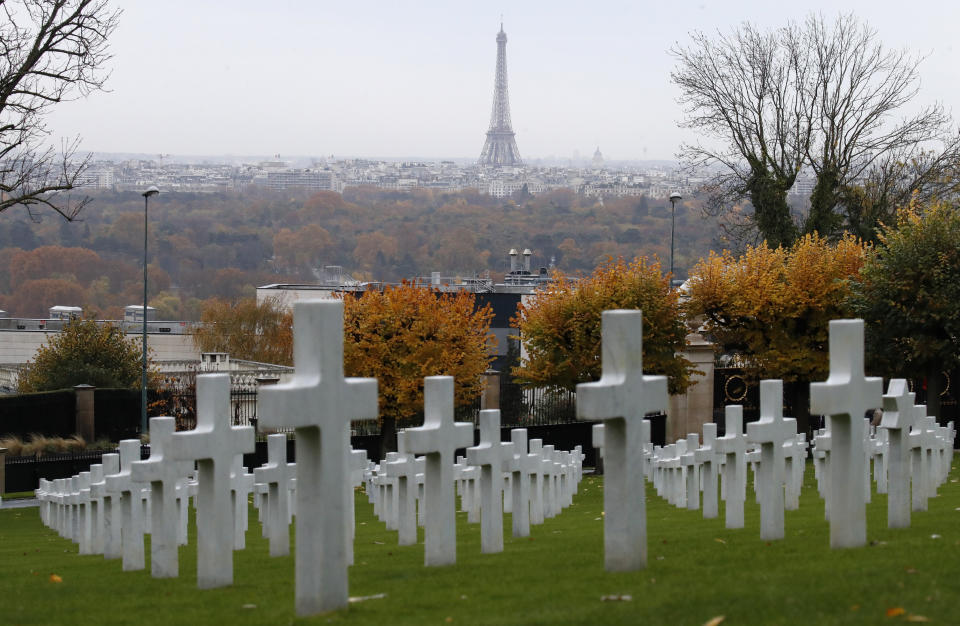The famous Paris landmark, the Eiffel Tower, looms in the background of the headstones during an American Commemoration Ceremony, Sunday Nov. 11, 2018, at Suresnes American Cemetery near Paris. Trump is attending centennial commemorations in Paris this weekend to mark the Armistice that ended World War I. (AP Photo/Jacquelyn Martin)