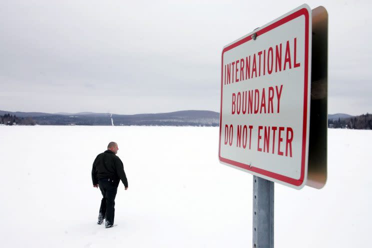 A U.S. Border Patrol Agent walks onto a frozen lake near Norton, Vermont that is split between Canada and the U.S. Some Canadians say they will boycott travel to the U.S. in protest of Trump's travel ban. Photo from Getty Images