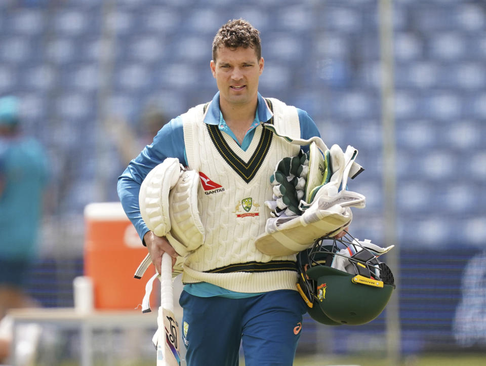 Australia's Alex Carey carries cricket equipment during a nets session at Headingley, Leeds, England, Wednesday, July 5, 2023. (Martin Rickett/PA via AP)