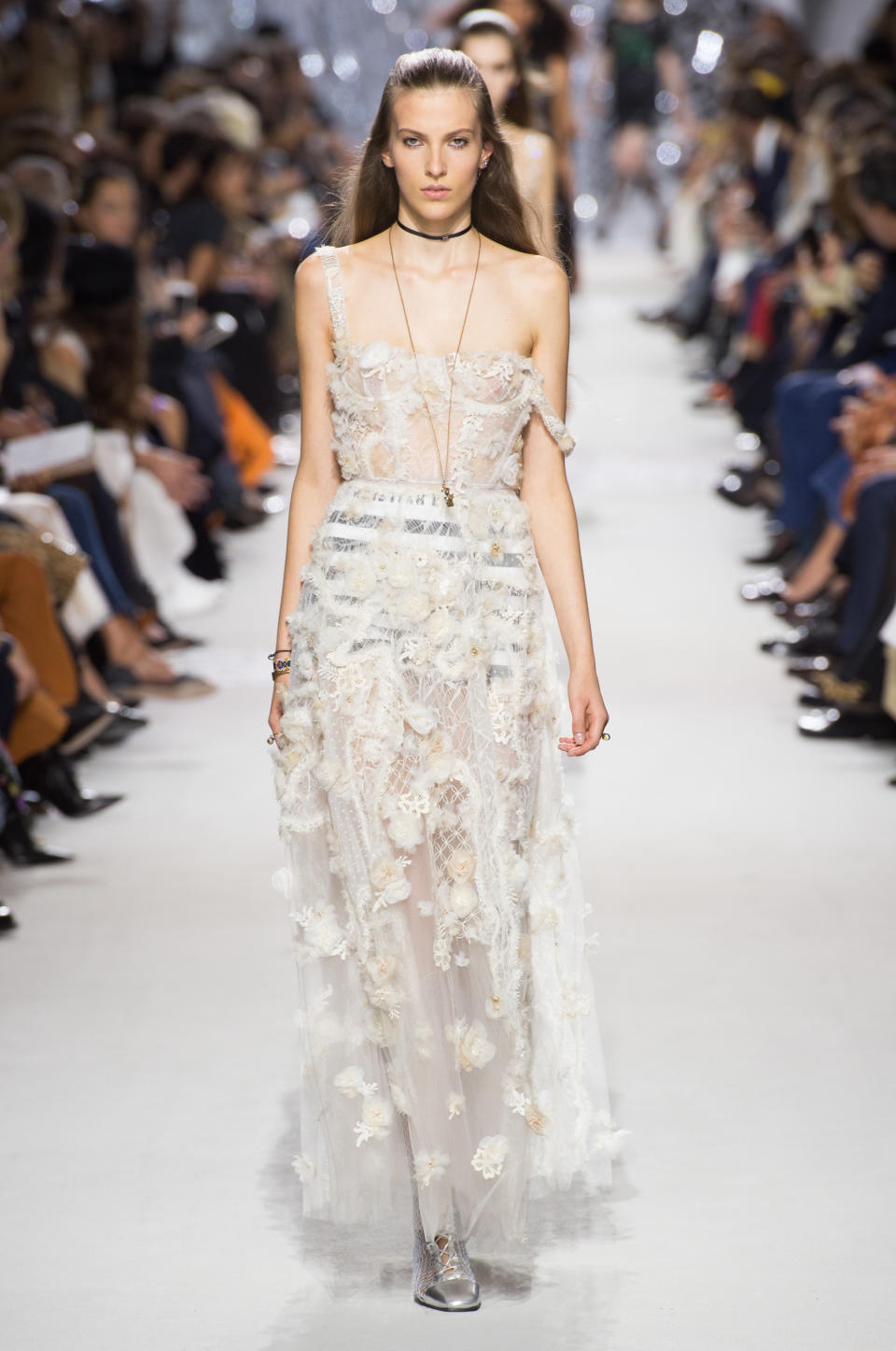 <p><i>White sheer lace dress from the SS18 Dior collection. (Photo: ImaxTree) </i></p>