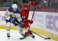 Detroit Red Wings defenseman Filip Hronek (17) tries to force Buffalo Sabres left wing Jeff Skinner (53) off of the puck during the second period of an NHL hockey game Saturday, Nov. 27, 2021, in Detroit. (AP Photo/Duane Burleson)