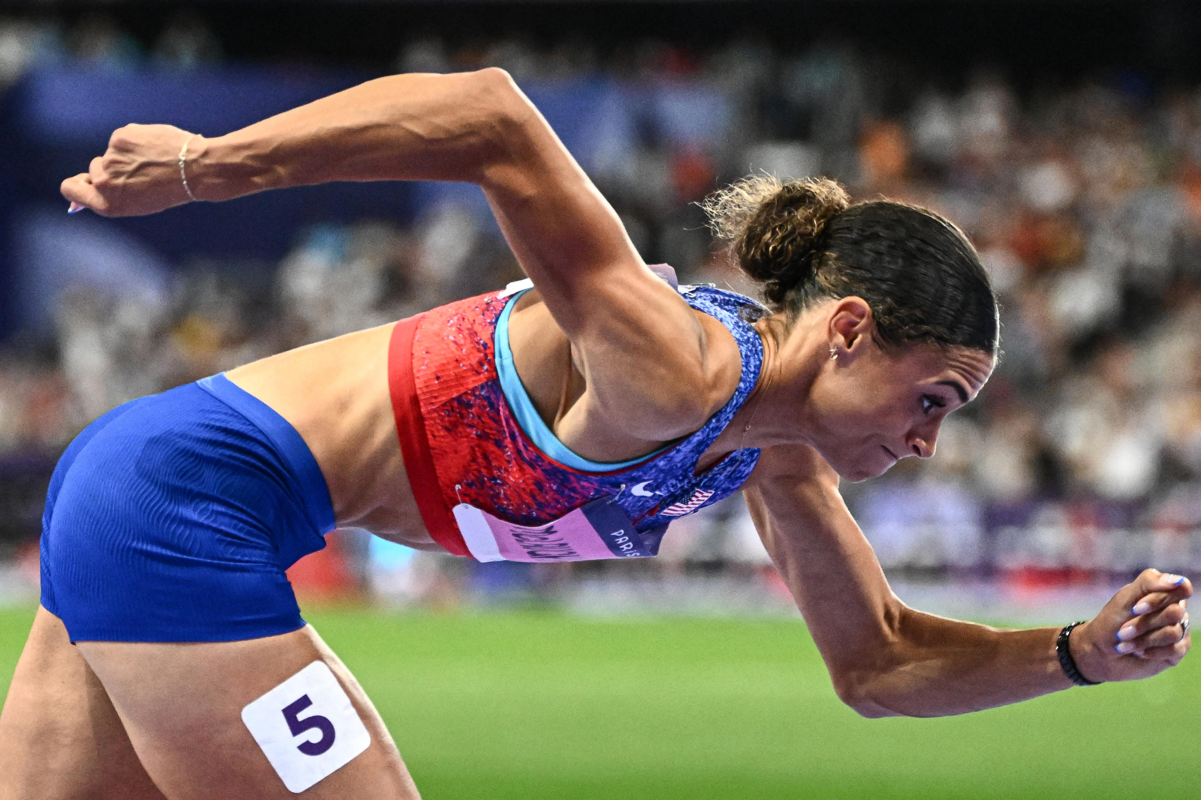 US' Sydney Mclaughlin-Levrone takes the start in the women's 400m hurdles final of the athletics event at the Paris 2024 Olympic Games at Stade de France in Saint-Denis, north of Paris, on August 8, 2024. (Jewel Samad/AFP/Getty Images)