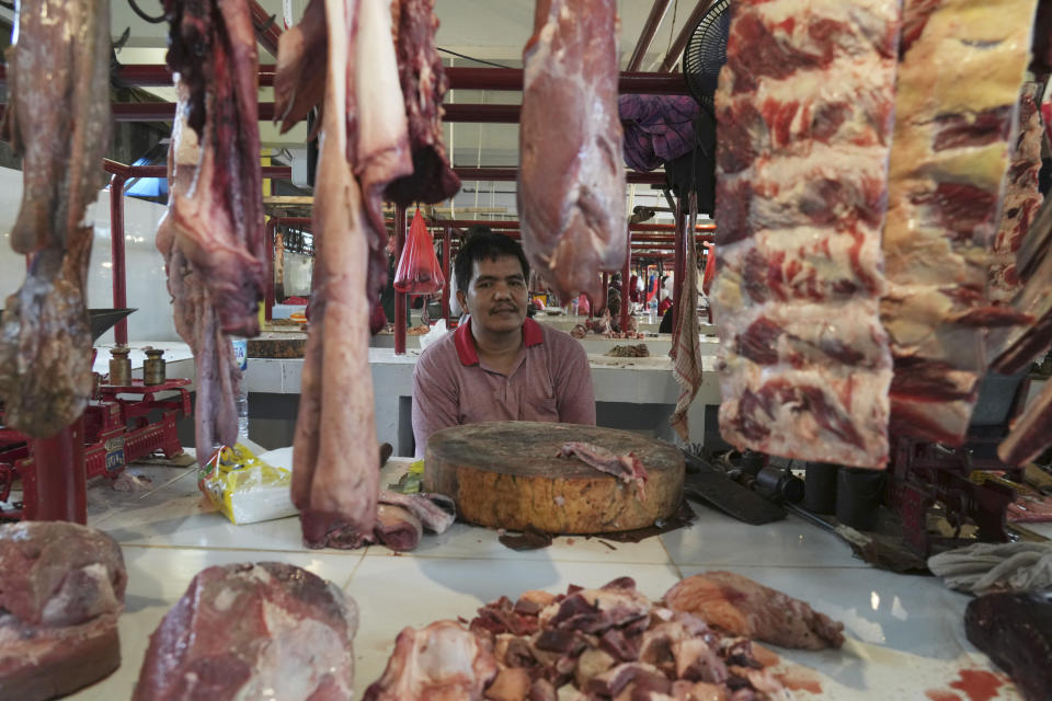 A meat vendor waits for costumers at a market in Jakarta, Indonesia, Wednesday, March 22, 2023. Millions of Muslims in Indonesia are gearing up to celebrate the holy month of Ramadan, which is expected to start on Thursday, with traditions and ceremonies across the world's most populous Muslim-majority country amid soaring food prices. (AP Photo/Achmad Ibrahim)