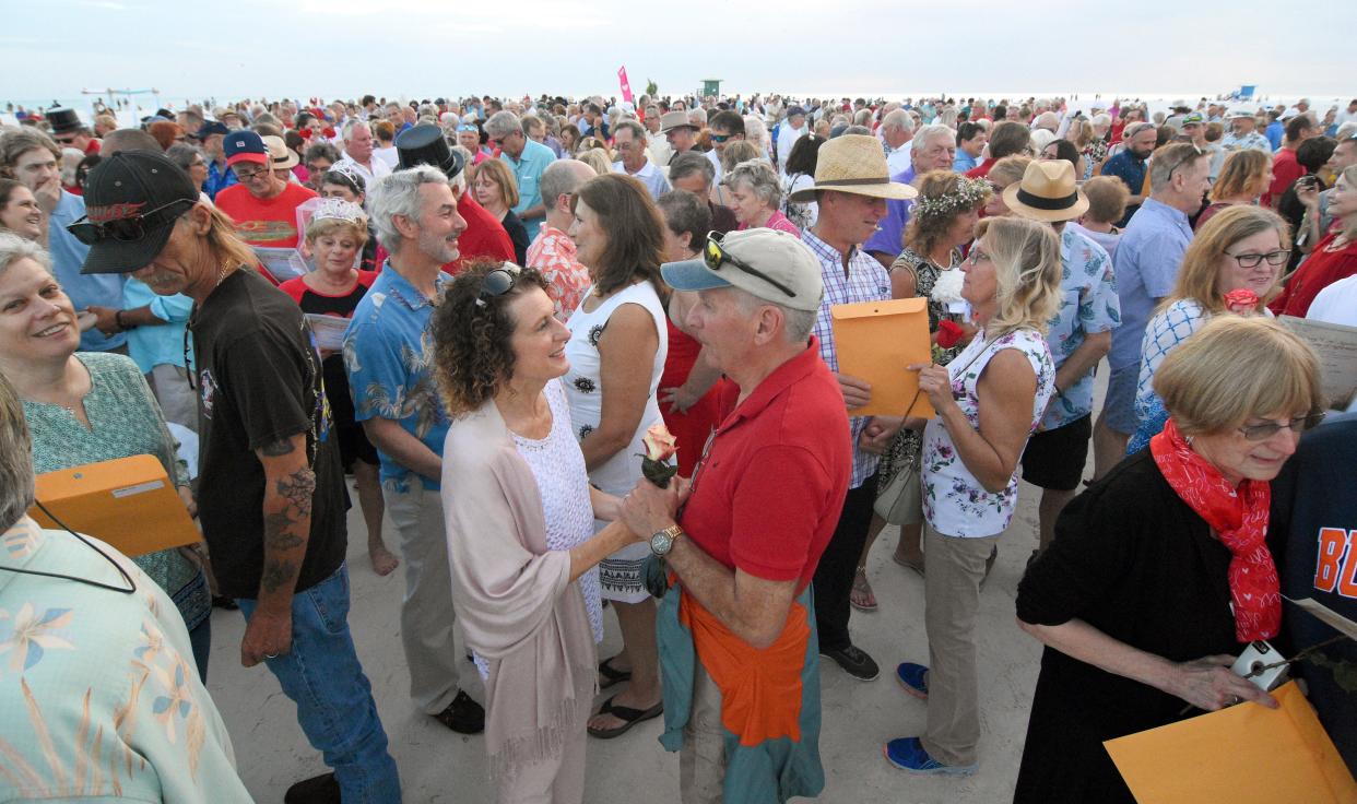 Hundreds of couples turned out for Sarasota County's popular Valentine's Day "Say I Do Again" sunset event on Siesta Key Beach.